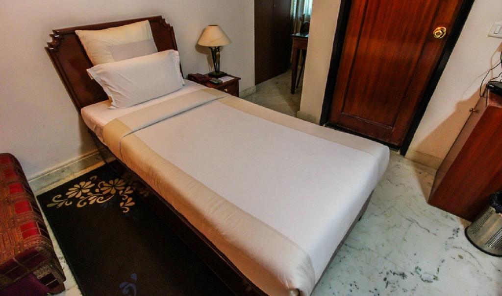 Hotel Pigeon International Bangalore Quarto foto