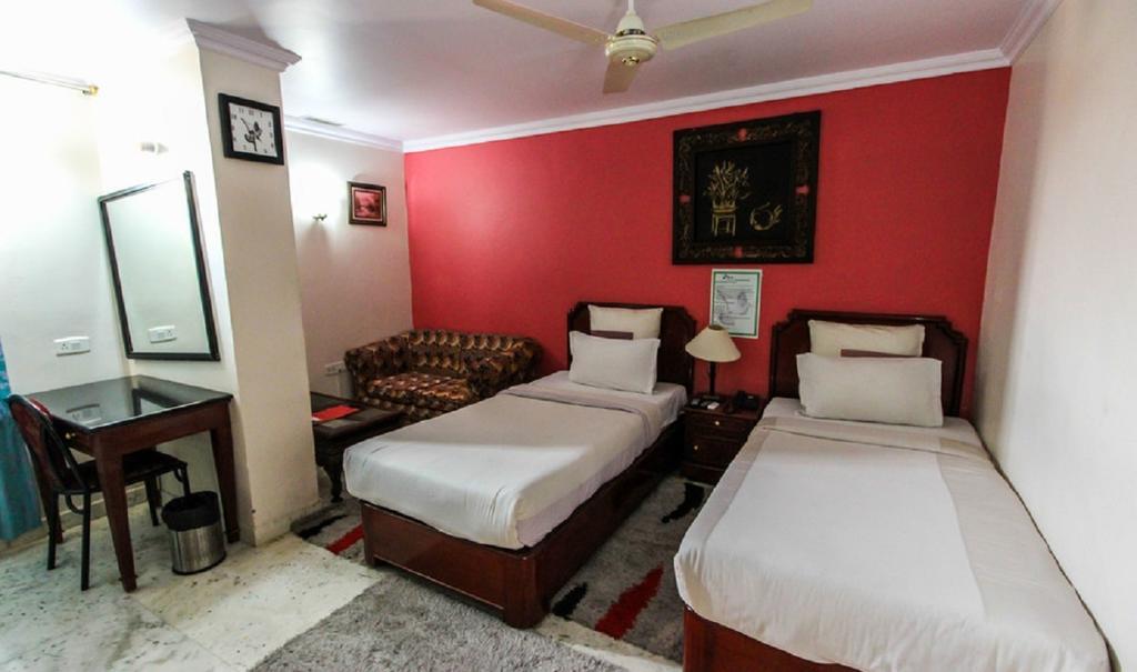 Hotel Pigeon International Bangalore Quarto foto